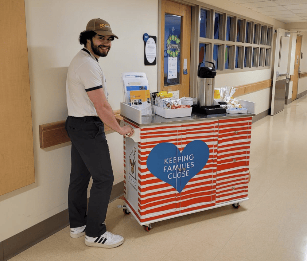 staff member working to deliver goods with the care cart